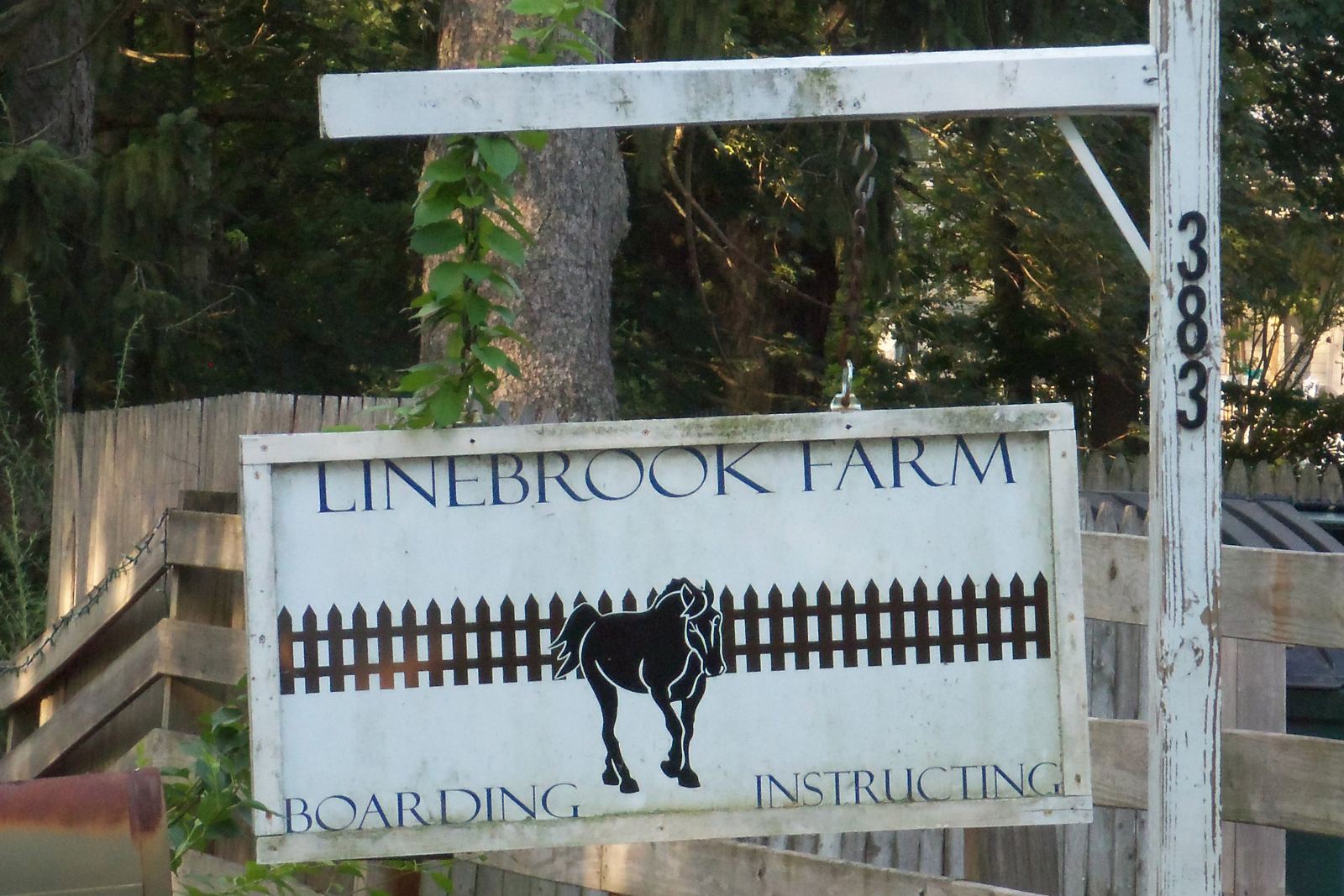 Linebrook Farm roadside sign for boarding and instructing at 383 Linebrook Road